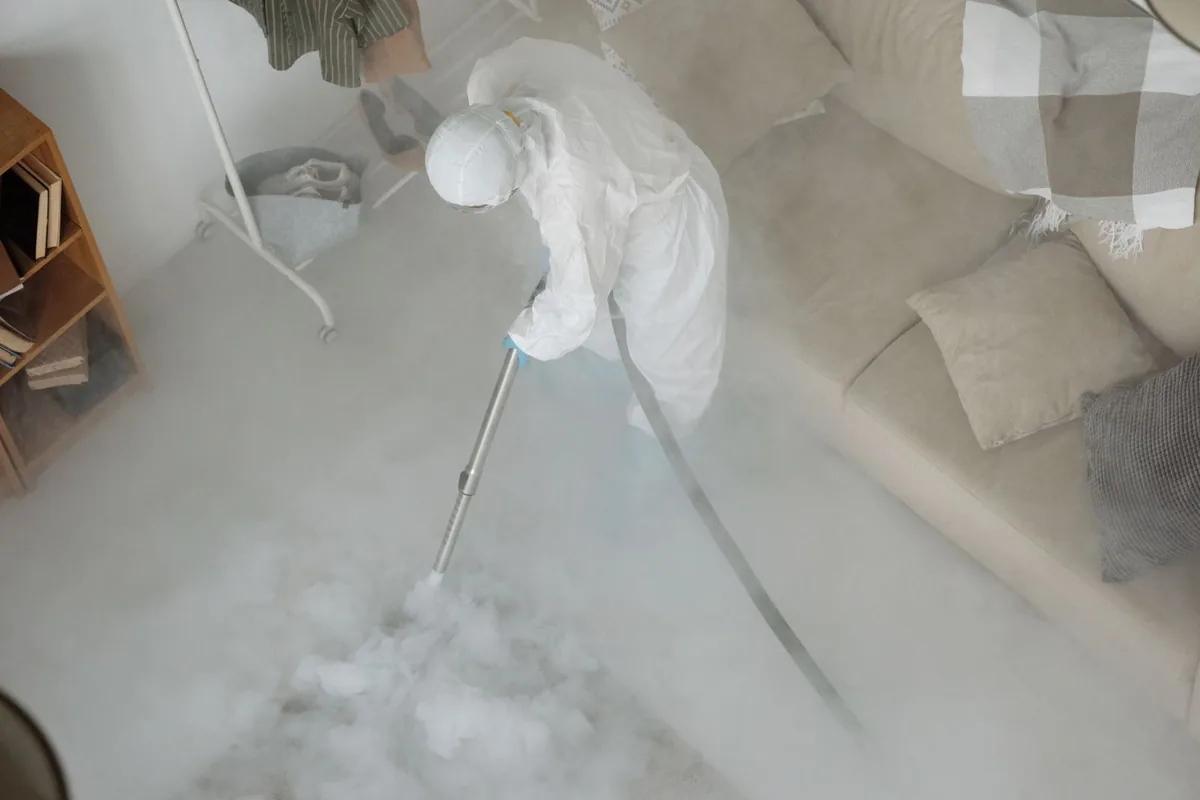 Biohazard cleanup technician in protective equipment, Highlands, NJ